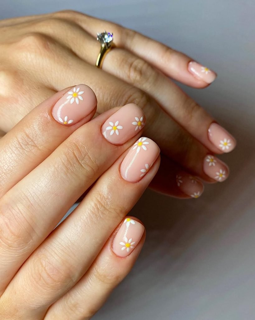 Milky Pink Nails With a Daisy Accent