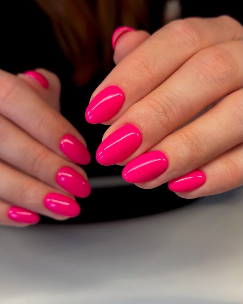 Glossy Neon Pink Almond Nails