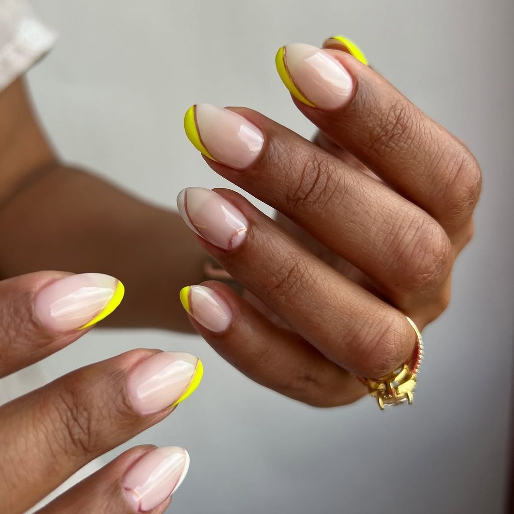 Side-Swept Yellow French on Almond Nails
